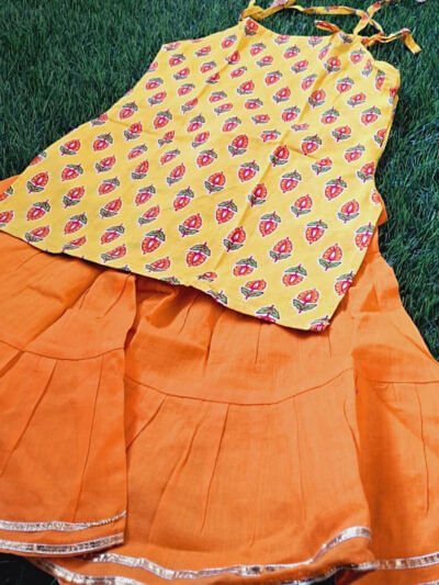 orange printed tieup kurti sharara